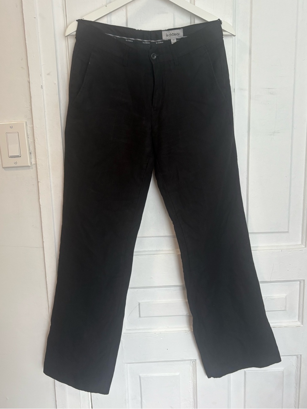 Woman’s black pinstripe dress pants